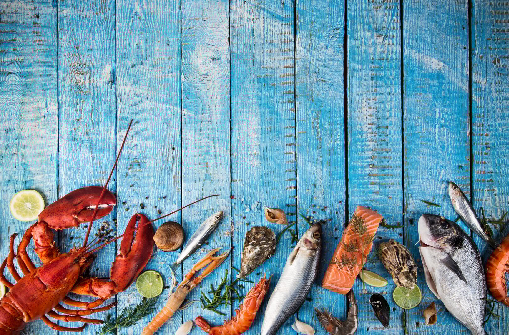 Fresh tasty seafood served on old wooden table